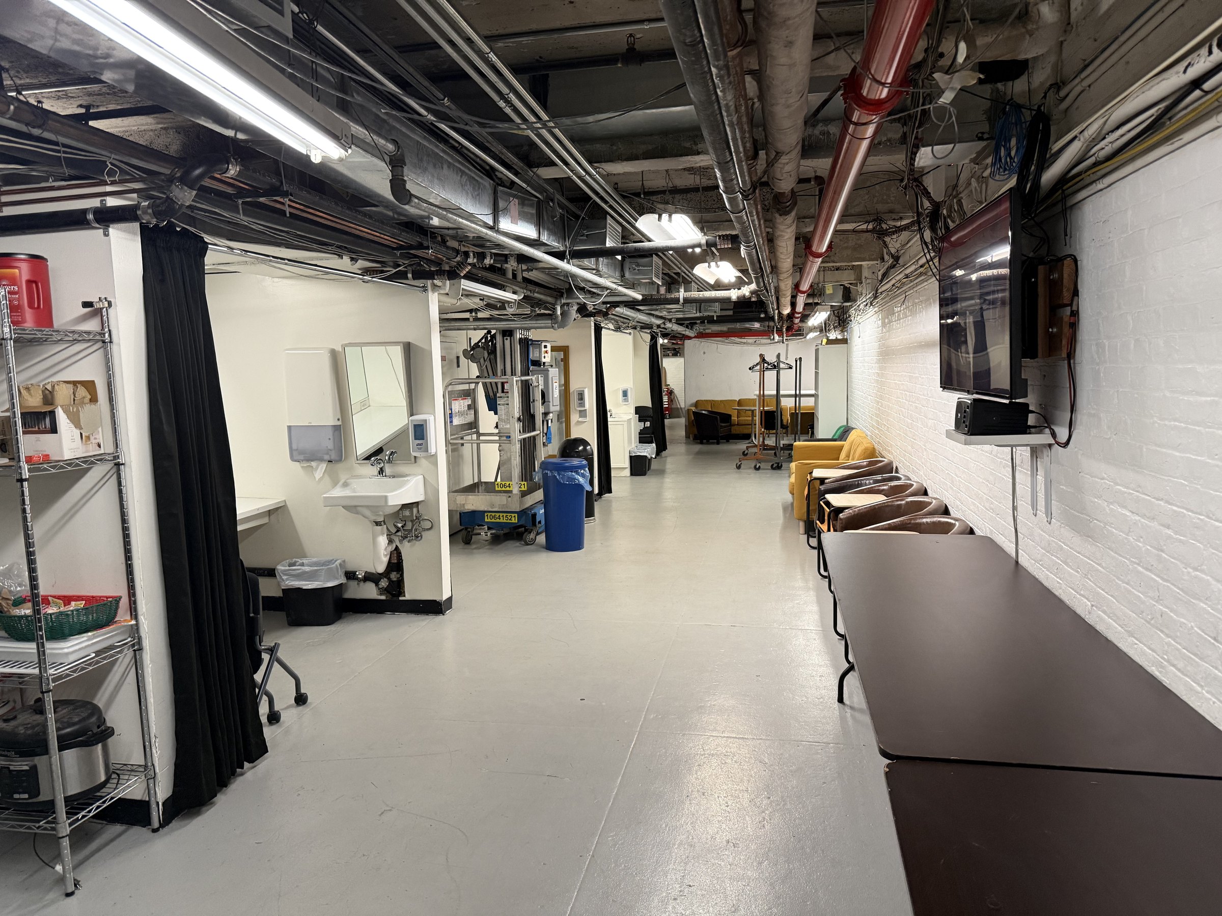 Cross-under backstage circulation path beneath The Town Hall stage