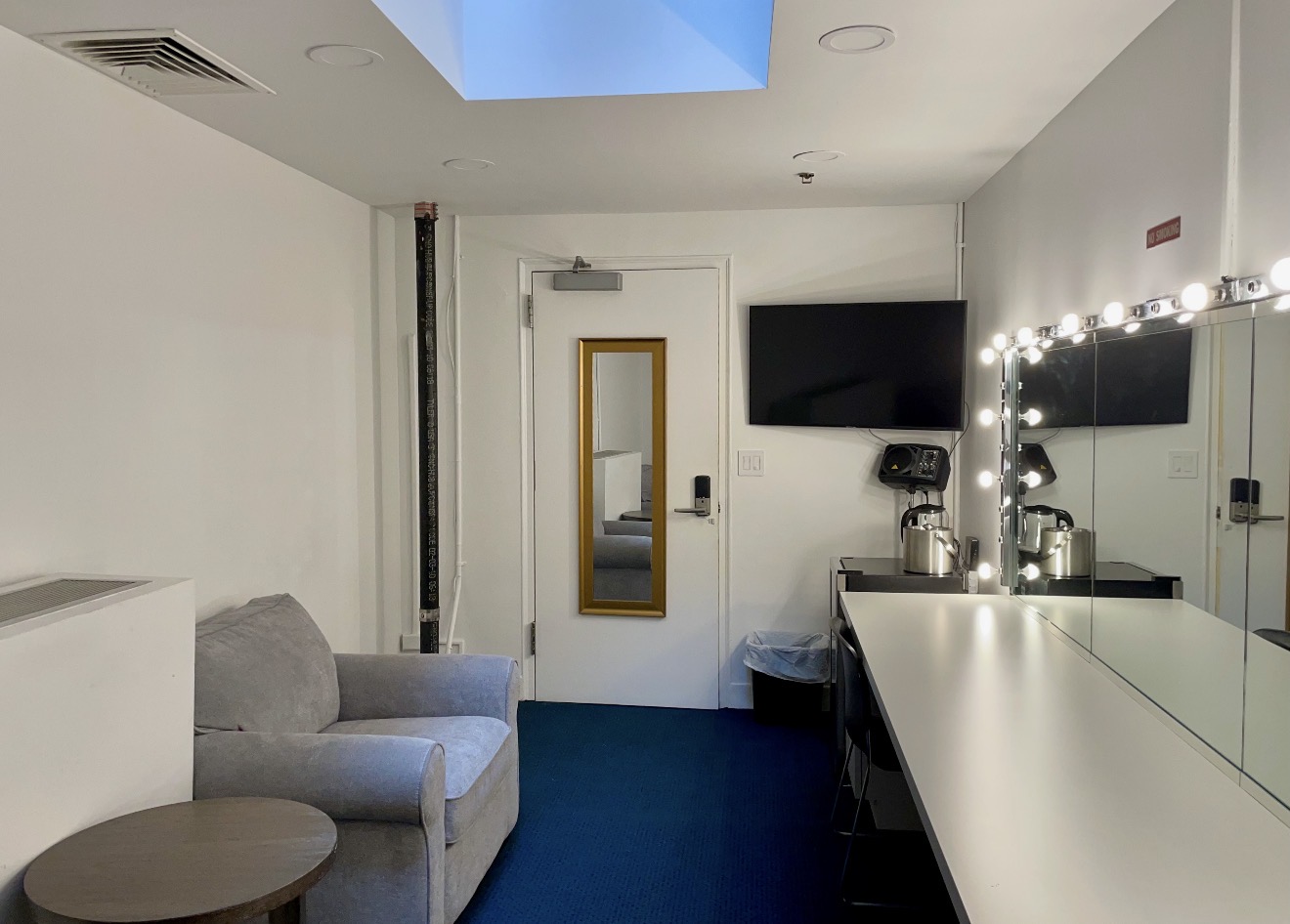 Stage-left dressing room seating and illuminated mirror counter
